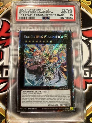 YuGiOh EXOSISTERS MAGNIFICA RA02-EN038🔥PSA 10🔥1st ED-2024 PLATINUM SECRET RARE - Image 1 of 4