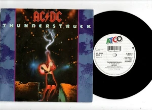 AC/DC - THUNDERSTRUCK / FIRE YOUR GUNS. UK 1990 ORIG 7" & BILD/ÄRMEL. N/NEUWERTIG - Bild 1 von 2
