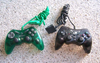 Nyko Black Omega 2 PlayStation 2 PS2 & InterAct Dual Inpact 2 Controllers - Image 1 of 2