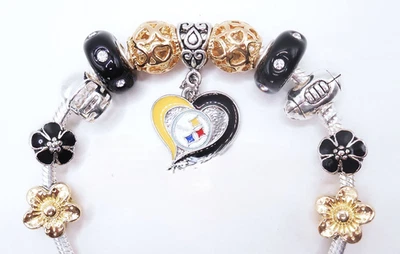 BRAZALETE CUENTAS O COLGANTES 11 PIEZAS NEGRO Y DORADO PITTSBURGH STEELER FÚTBOL Foto 1 de 3