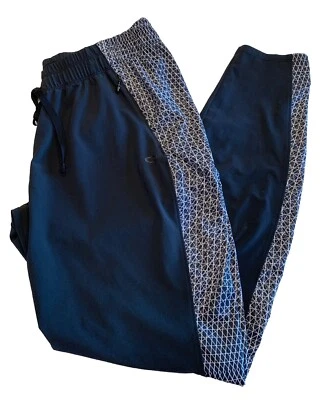 Pantalones de chándal Oakley para mujer con estampado negro bolsillos con cremallera elásticos cordón cintura medianos Foto 1 de 4