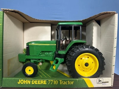 John Deere 7710 Tractor with Duals Cab and Front Weights #5167 - Image 1 of 4