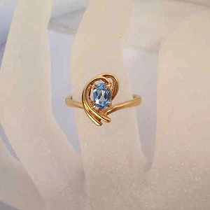 Delicate .64ct Blue Topaz Solid 10K Y Gold Ring Fine Jewelry - Picture 1 of 5