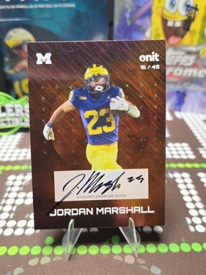 Tarjeta de fútbol americano Jordan Marshall 2025 Onit Gravity Michigan AUTO 1/49 naranja 🔥 Foto 1 de 2