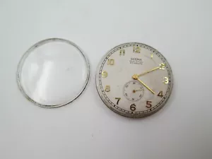 Máquina y esfera reloj de pulsera Dogma. Cuerda manual. Años 50. Segundero - Imagen 1 de 9