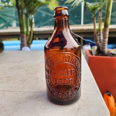 GA Coleman Kempsey Amber Glass Dumpy Shape 10oz Size Crown Seal - image 1 of 4