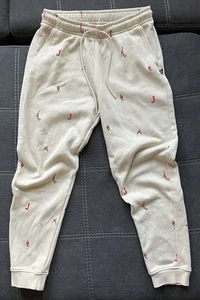 Pantalones de vellón Air Jordan Holiday Edition estampado total para hombre grandes DV9390-206 tostado - Imagen 1 de 8
