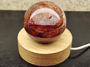 Bola esfera cristal hematoide cuarzo fuego calidad superior 53 mm con soporte de luz - Imagen 1 de 7
