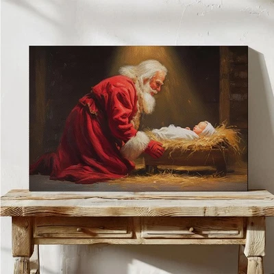 Arte de pared de Navidad de fe en lienzo de Papá Noel arrodillado ante el bebé Jesús Foto 1 de 4