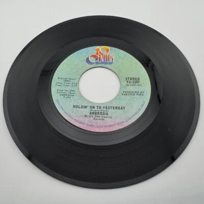 Ambrosia 45 rpm "Holdin' On To Yesterday" & Make US All Aware Vinyl Record - Image 1 of 2