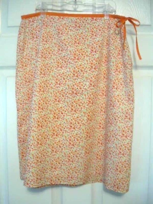 Falda para dama 6, debajo de la rodilla, corbata lateral y cremallera, lavable, de Cherokee Foto 1 de 4