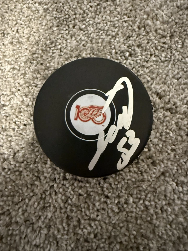 Mo Seider Signed Red Wings Centennial Puck  W/COA - Image 1 of 1