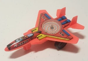 JIMMY TOYS 80's 4'' RED F-15 EAGLE JET FIGHTER TIN & PLASTIC SPINNING TOP - Picture 1 of 6