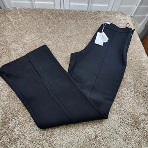 Lucy Paris Damen Gr. Medium schwarz Kari Schlitz Bündchen Schlag Bein Hose neu Etikett - Bild 1 von 8