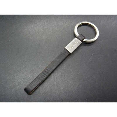 Portachiavi con ciondolo borsa Coach in pelle nero argento AB usato - Immagine 1 di 3