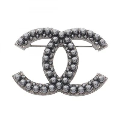 Broche prendedores marca CHANEL COCO acero inoxidable usado mujer CC mujer Foto 1 de 3