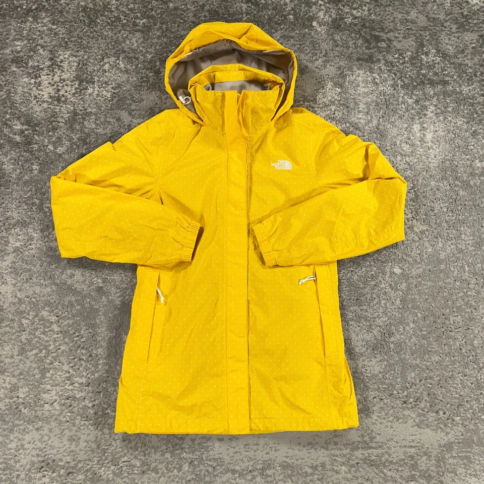 Chaqueta de lluvia North Face para mujer pequeña amarilla blanca lunares resolución logotipo exterior Foto 1 de 4