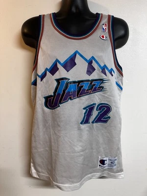 Camiseta deportiva de baloncesto NBA Utah Jazz #12 John Stockton Champion para hombre talla: 40 blanca usada Foto 1 de 4