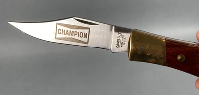 Camilo Nº 4: Navaja de bolsillo plegable de caza con bloqueo trasero; grabada "CHAMPION" Foto 1 de 4