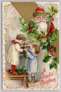 Christmas 1907 Winsch Back Santa Holly Snow Border Children Garlands Postcard - Imagen 1 de 3
