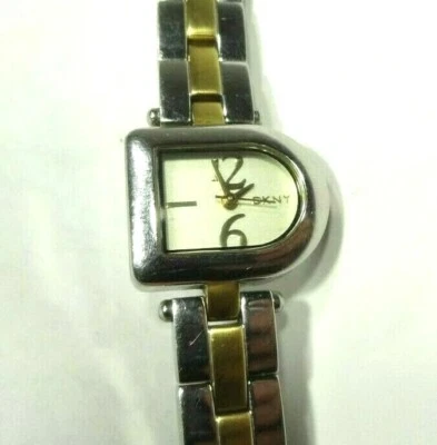 RELOJ DKNY DAMAS VINTAGE PLATA FORMA D CARA ACERO INOXIDABLE ORO PULSERA  Foto 1 de 4
