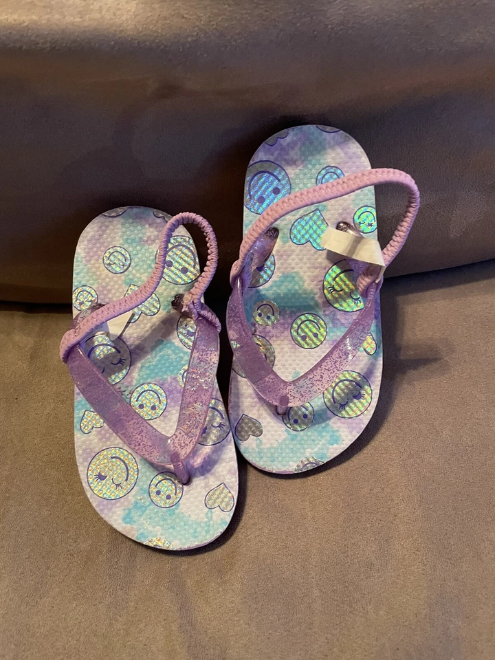 Chanclas sonrientes moradas The Childrens Place para niñas talla 8/9 Foto 1 de 3