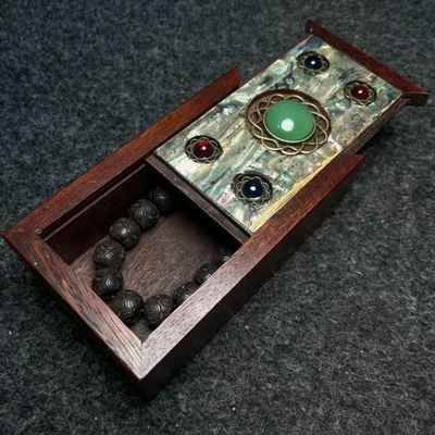 Collection of agarwood carved bracelets in a rosewood inlaid colorful shell box - Image 1 of 4