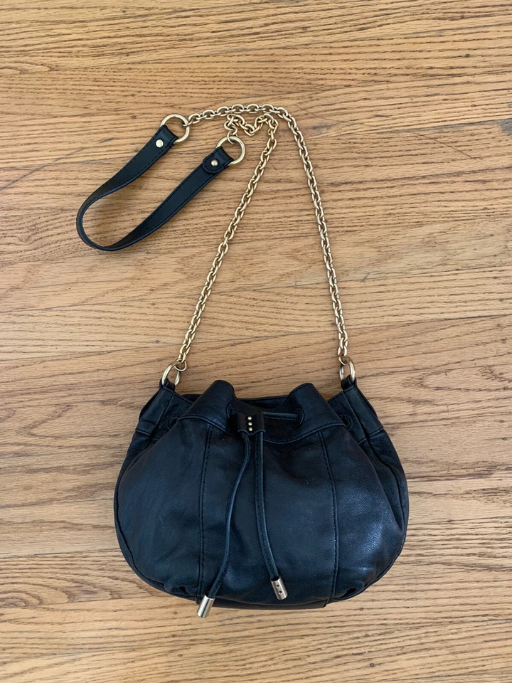 Juicy Couture black leather gold-tone chain drawstring bag cross-body bag - Image 1 of 4