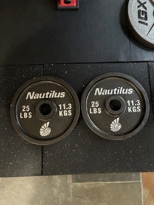 "Placas de peso olímpicas Nautilus vintage de 25 libras, par-2 placas 50 libras 2"" 25 X 2" Foto 1 de 2