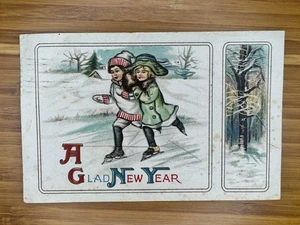A Glad New Year Postcard Ice Skating Children Embossed 1914 - Picture 1 of 2