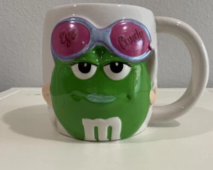 Lápiz labial Eye Candy verde M&M's chocolate caramelos grande taza de coleccionista galería - Imagen 1 de 6