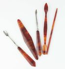 Bakelite nail care set from the 1930s, amber marble.
