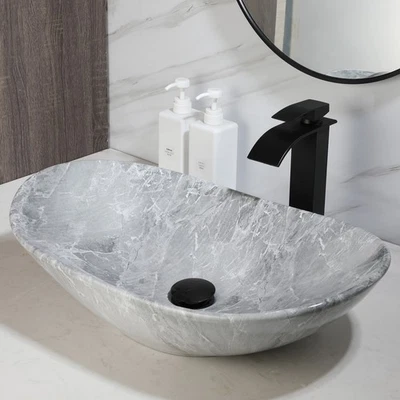 Fregaderos de lavabo de baño ovalados de cerámica y grifo mezclador de drenaje Foto 1 de 4