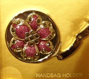 LIZ CLAIBORNE HANDBAG PURSE HOLDER - SILVER WITH PURPLE FLOWER GEM STONE - NIB - Picture 1 of 3