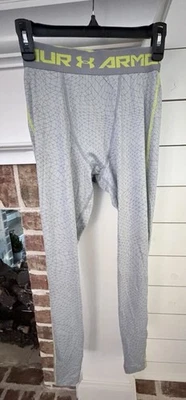 Pantalones de compresión Under Armour HeatGear en gris y amarillo. Hombre Talla Mediana Foto 1 de 4