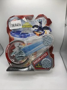 Bakugan BakuBlaster con Strikor de Spin Master nuevo sellado en tarjeta desgastada - Imagen 1 de 16