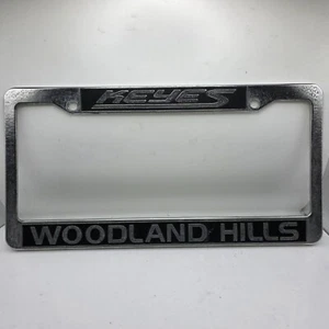 Keyes Woodland Hills Silver Plastic License Plate Frame Front Or Rear - Bild 1 von 2