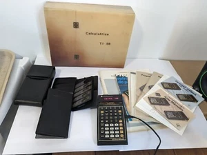 TI 58 programmable qui s'allume avec 2 modules library et beaucoup de docs - Photo 1/24