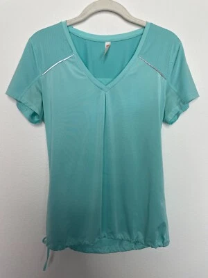 Top deportivo Lucy pequeño azul verdoso malla manga corta cordón tiras reflectantes Foto 1 de 4