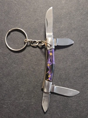 Navaja de bolsillo vintage con llavero de 2-1/2 pulgadas púrpura con reflejos dorados en muy buen estado Foto 1 de 4