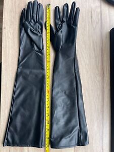 Faux leather (not lycra) black elbow length gloves. BNWT. Size Large