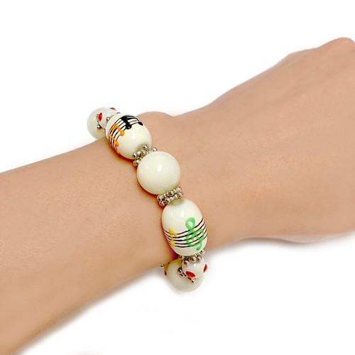OFF WHITE Bracciale Musica Vetro Perline Elastico Donna Braccialetto Note Musicali Colore Beige Crema