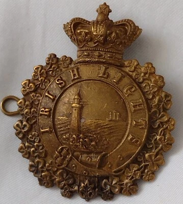 VICTORIAN Irish Lights Cap Badge QVC Brass 2 Lugs ANTIQUE Original - Image 1 of 4