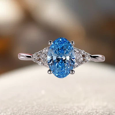 Anillo de diamantes cultivados en laboratorio IGI de oro blanco de 14 quilates de lujo de 2,15 quilates azul vivo corte ovalado Foto 1 de 4