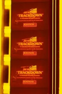 TRACK DOWN TRAILER WARM COLOR 16MM FILM ROLLED NO REEL C6 - Imagen 1 de 7