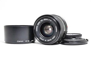 Lente gran angular Canon "casi como nueva" nueva FD 35 mm F/2 NFD MF con capucha de Japón 1781 - Imagen 1 de 24