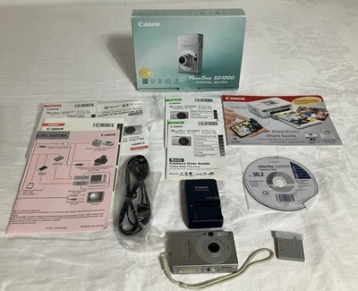 Cámara digital Canon PowerShot SD1000 ELPH 7,1 MP plateada probada manuales cargador + Foto 1 de 4
