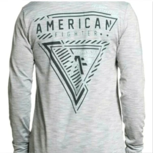 NUEVO CON ETIQUETAS Chaqueta Pull Over American Fighter Para Hombre Gris Gráfico Media Cremallera Manga Larga-M - Imagen 1 de 5