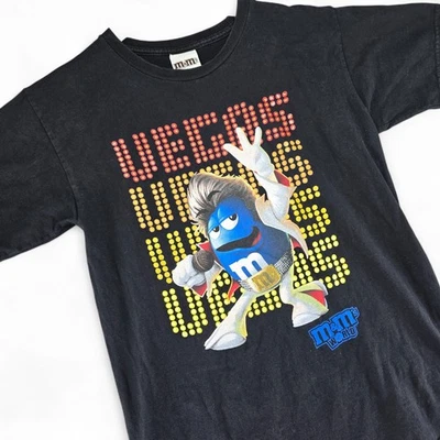 Camiseta negra con gráfico de personajes de Elvis World Vegas de M&M's para hombre pequeña 2009 Foto 1 de 4