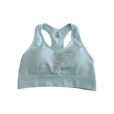 Sujetador deportivo New Balance talla L azul aguamarina y plata espalda deportiva acolchado extraíble Foto 1 de 4